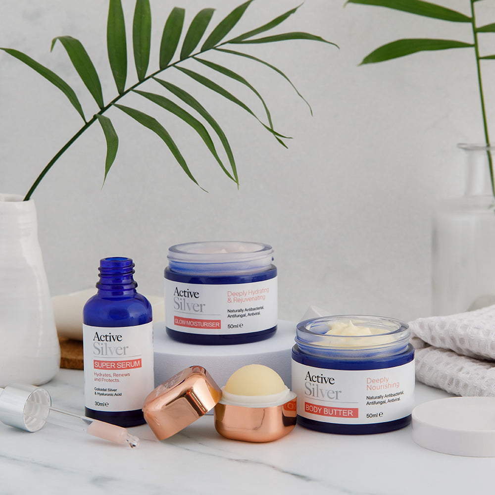 Active Silver Beauty Bundle Product Lineup In Bathroom With Lids Off