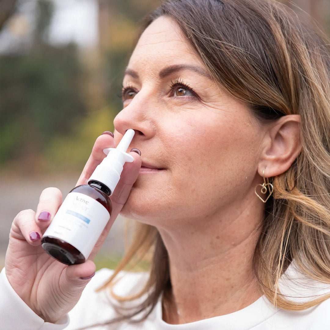 Active Silver Nasal Spray being used by a woman outside